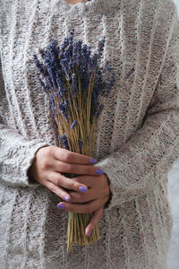 Close-up of woman hand holding plant