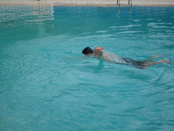 High angle view of woman swimming in pool