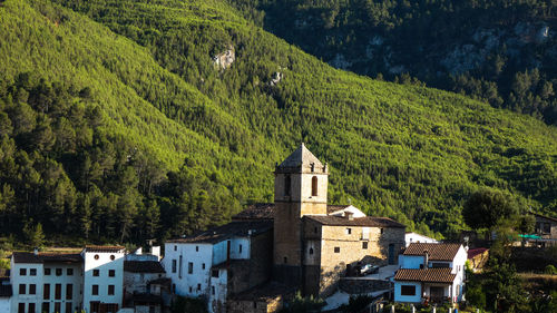 High angle view of trees and buildings against sky