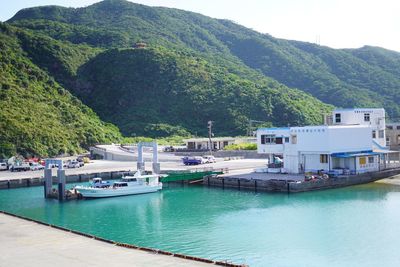 Boats moored in bay