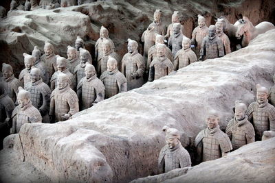 Statues by rock formations