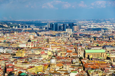 High angle view of city buildings against sky