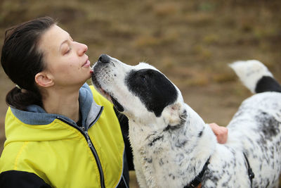 Side view of woman with dog