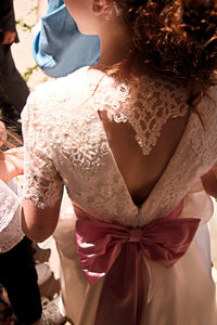 Midsection of woman standing with umbrella