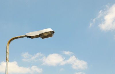 Low angle view of street light against sky