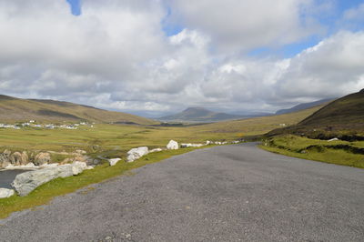 Road amidst landscape against sky