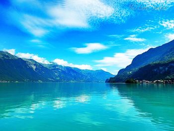 Scenic view of lake against cloudy sky