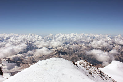 Scenic view of snow covered landscape against clear sky