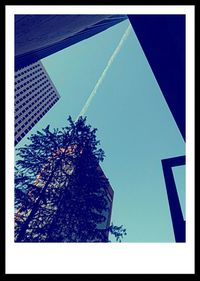 Low angle view of built structure against blue sky