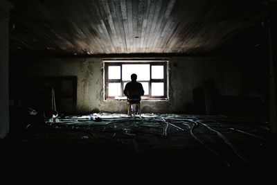 Man standing in abandoned building