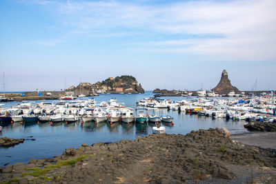 Boats in sea against sky