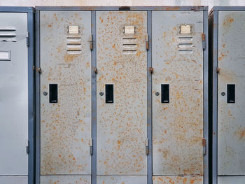 Full frame background of old grungy rusty lockers