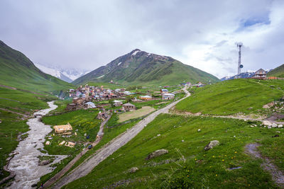 Scenic view of landscape and mountains against sky