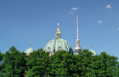 Low angle view of church against blue sky