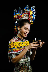 Low angle view of woman standing at night