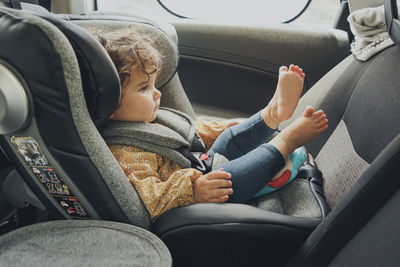 Low section of man driving car