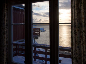 Close-up of sea seen through window