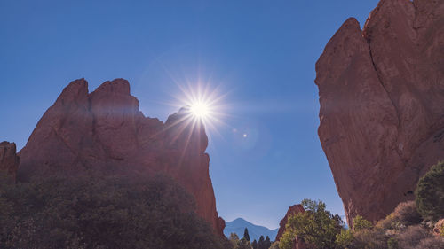 Low angle view of rocks against sky