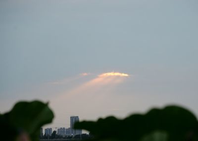 Silhouette buildings against sky during sunset