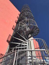 Low angle view of modern building against clear blue sky