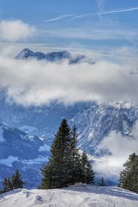 Scenic view of snowcapped mountains against sky