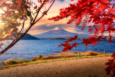 Scenic view of lake against orange sky