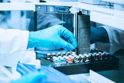 Midsection of scientist working in laboratory