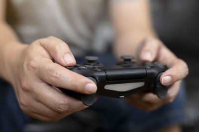 Close-up of hand holding camera