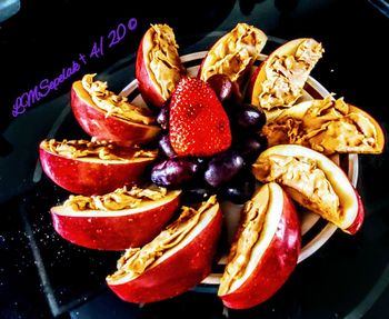 High angle view of fruits in plate on table