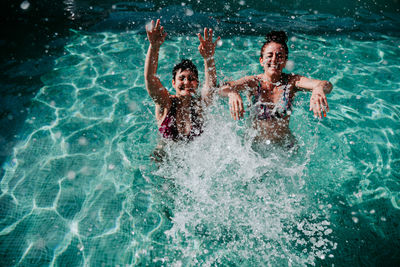 Women enjoying in swimming pool