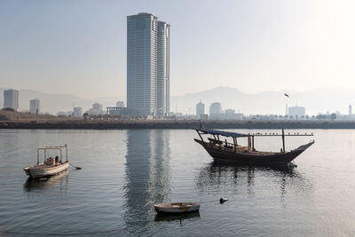Boats in sea against sky