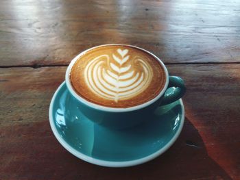 High angle view of cappuccino on table