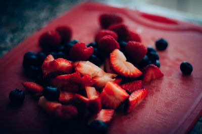 Close-up of chopped fruits on table
