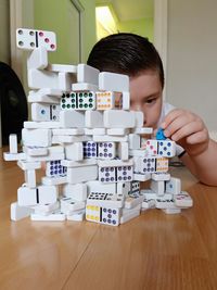 Portrait of boy playing with toy on table