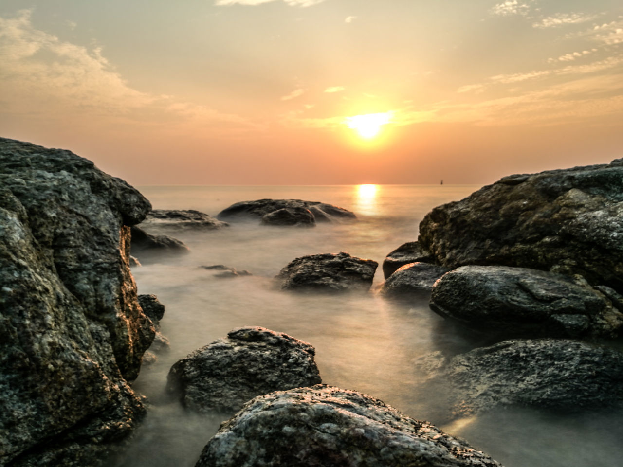 ROCKS ON SEA AGAINST SKY DURING SUNSET