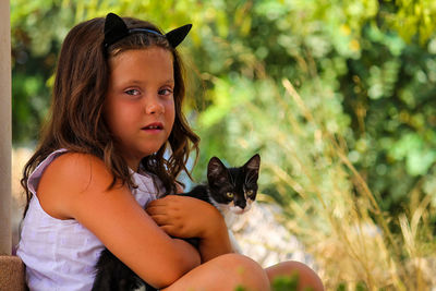 Portrait of girl with cat