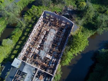 High angle view of abandoned building by river