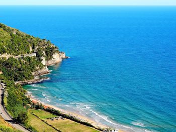 High angle view of sea against blue sky