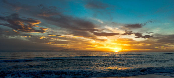 Scenic view of sea against sky during sunset