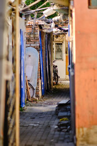 Narrow alley amidst buildings in city