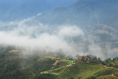 High angle view of fog on field against sky