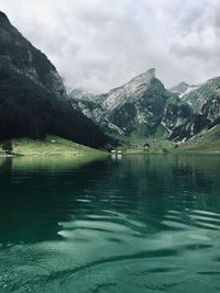 Scenic view of lake and mountains against sky seealpsee