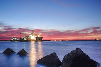 Scenic view of sea against sky at sunset