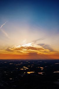 Scenic view of sunset over city