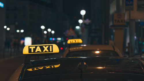 Close-up of illuminated taxi at night