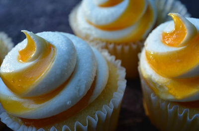 Close-up of mango puree on cupcakes