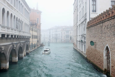 Canal passing through city buildings