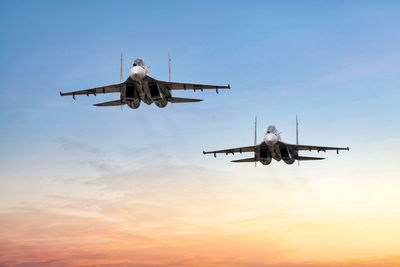 Squadron of sukhoi su30 mk2 fly by atc tower in early morning, low attitude air show