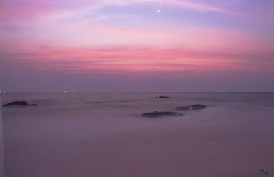 Scenic view of sea at sunset