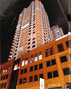 Low angle view of modern building at night